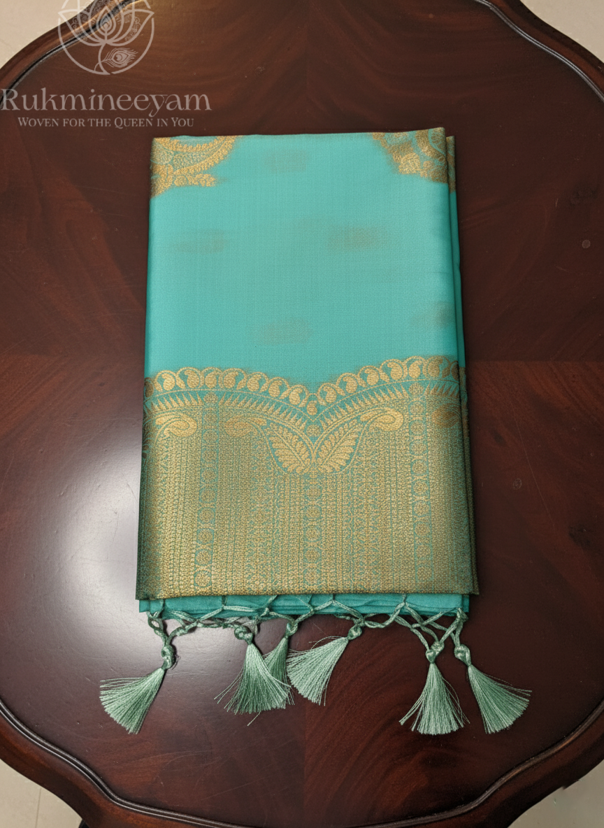 Teal Blue Silk Saree with Gold Zari Border & Tassels