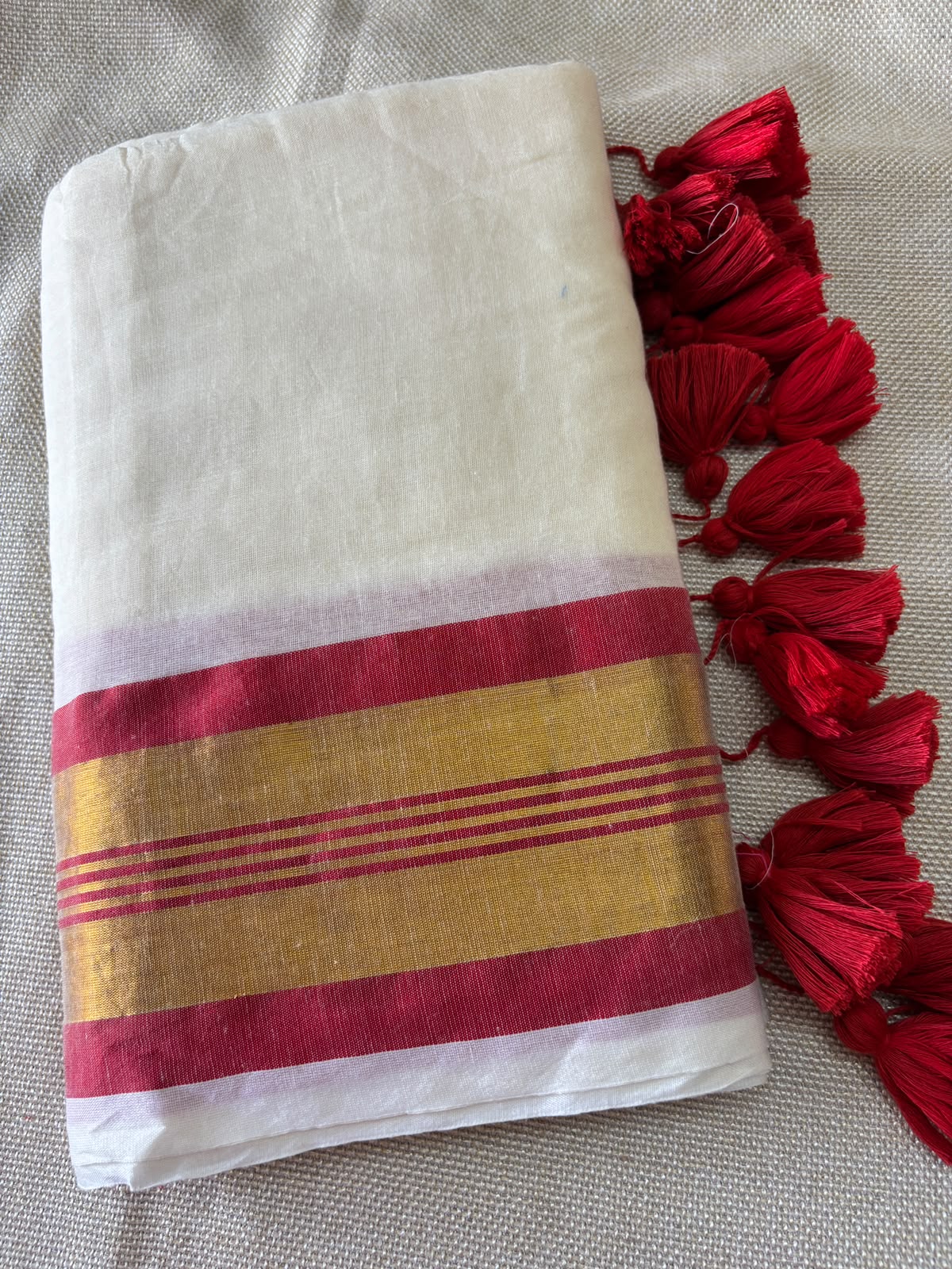 Premium Kerala Mul cotton Off-white Saree with Red & Gold Zari Border